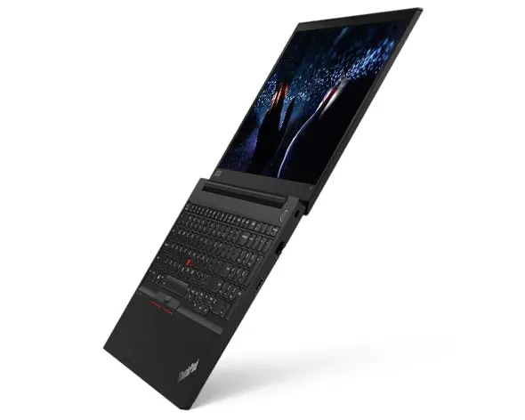 A ThinkPad E15 opened and stood on the edge of its keyboard, revealing the backlit keyboard and 15.6-inch FHD display