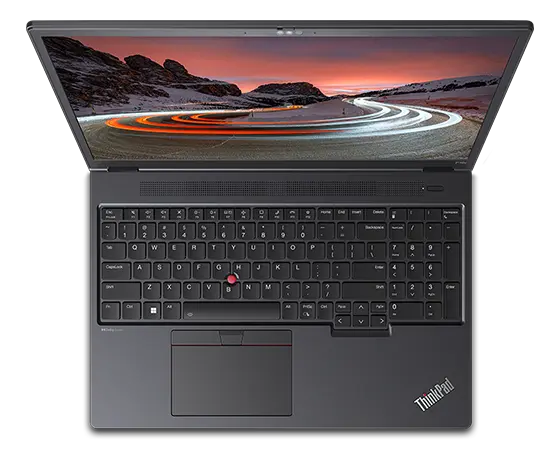 Bovenaanzicht van een Lenovo ThinkPad P16v (16" AMD) mobile workstation, geopend, met het volledige toetsenbord zichtbaar en het Windows 11-startscherm met een afbeelding van een berg op het beeldscherm