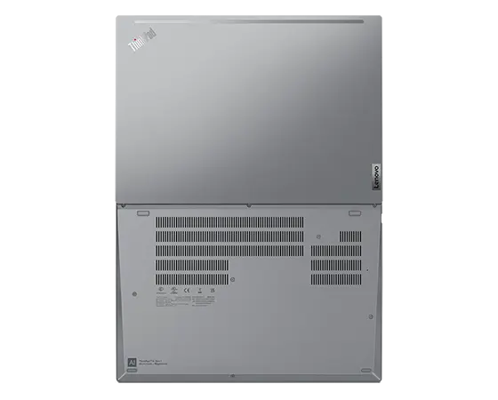 Aerial view of ThinkPad T16 Gen 1 (16” AMD) laptop, opened 180 degrees, laid flat, showing front and rear cover