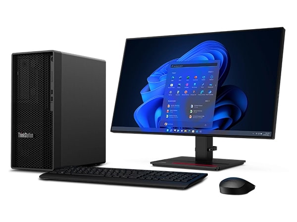 Front, right side profile of Lenovo ThinkStation P2 Tower workstation coupled with Lenovo desktop, a wireless keyboard and a wireless mouse with Windows 11 pro menu displayed on screen.