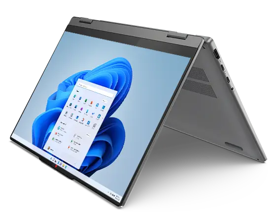Nærbillede af Lenovo IdeaPad 5 2-i-1 Gen 9 (14'' AMD) bærbar computer i Luna Grey set forfra og fra venstre, åbnet i telttilstand med fokus på en Windows 11 Pro-menu vist på skærmen.