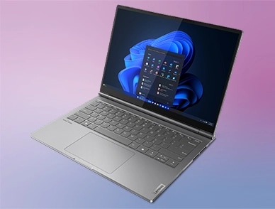 Far-off, right side view of the Lenovo ThinkBook Plus Gen 5 Hybrid (14” Intel) laptop open, focusing its keyboard base & display with Windows 11 Pro menu opened on the screen.