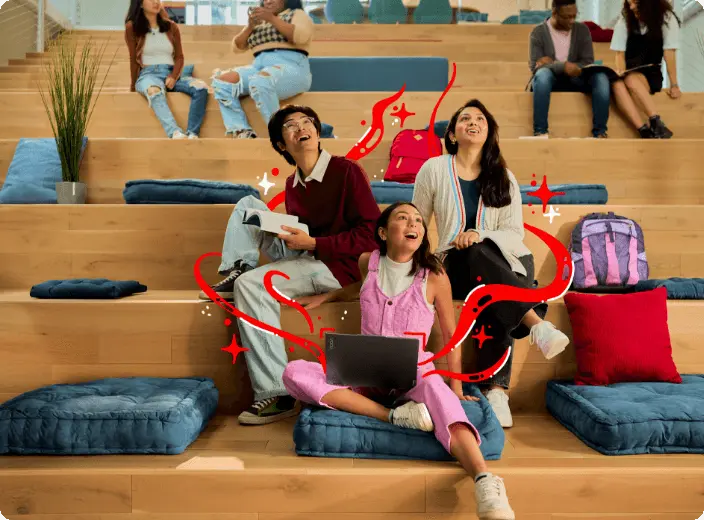 Three young people sitting on cushions on step-style wooden bleacher seats, one using a Lenovo laptop, one reading a book, all looking upward with red wavy graphics superimposed.