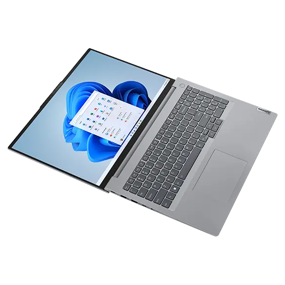 Overhead shot of the Lenovo ThinkBook 16 Gen 6 laptop open 180 degrees with focus on keyboard & display.