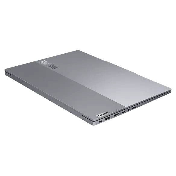 Side view of Lenovo ThinkBook 14 Gen 6+ (14 inch Intel) laptop, closed, at slight angle, showing top cover & right-side ports