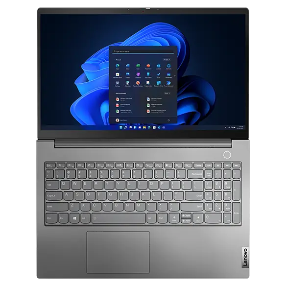 Overhead shot of Lenovo ThinkBook 15 Gen 5 laptop open 180 degrees with Windows 11 Pro Start menu on screen.