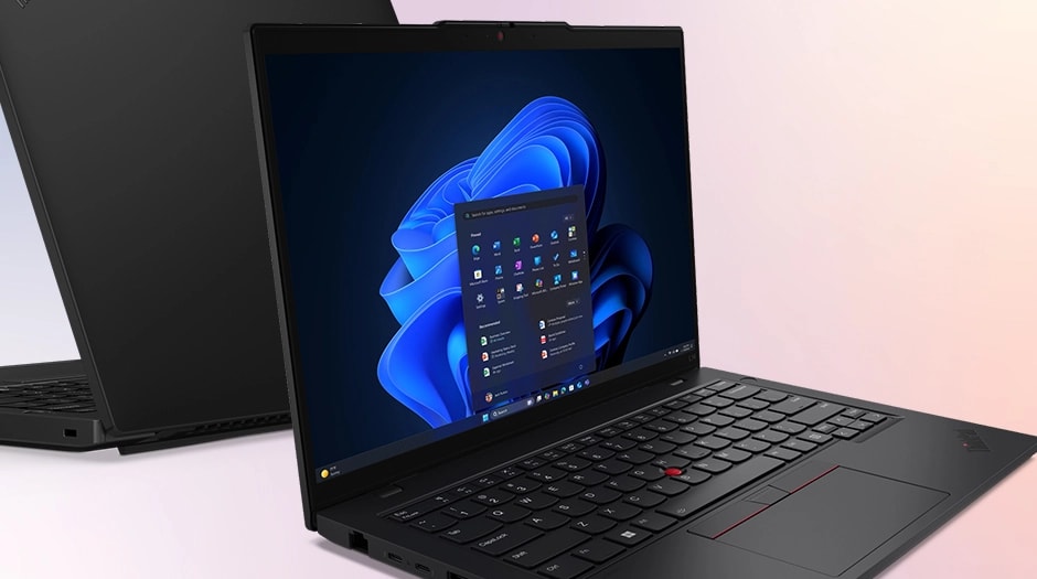 Two Lenovo ThinkPad L14 Gen 6 (14" Intel) laptops, back-to-back – right-rear view, lid open and left-front view, lid open, with Windows 11 menu in front of Windows bloom background on the display