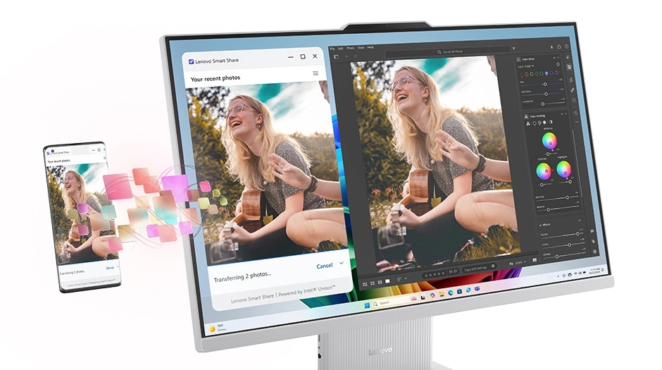 Lenovo IdeaCentre AIO Gen 10 (24" AMD) all-in-one Copilot+ PC in Cloud Grey – close-up of display with smartphone behind it, showing the transfer of an image of a woman playing a guitar