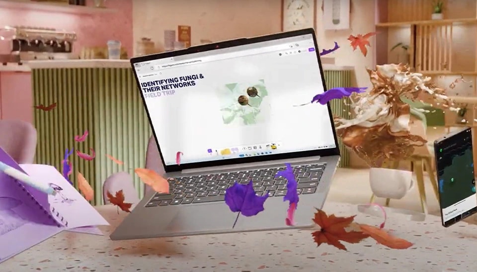 Surrounded by colorful leaves, an IdeaPad Slim laptop hovers over a table.