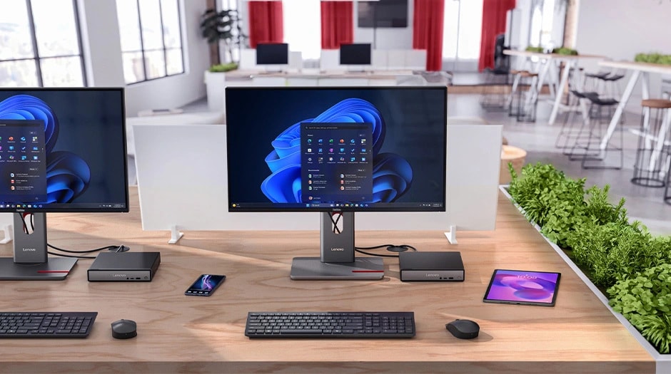 Lenovo ThinkCentre Neo 50q Gen 6 (Intel) Tiny PC in modern office, dual monitors displaying Windows menu & some accessories placed on the desk.