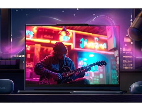 Lenovo YOGA 9i Gen 11 displaying a musician playing guitar, demonstrating immersive visual experience. מחשב נייד Yoga 9 2-in-1 Aura Edition 14IPH11 83SE001MIV מבית Lenovo