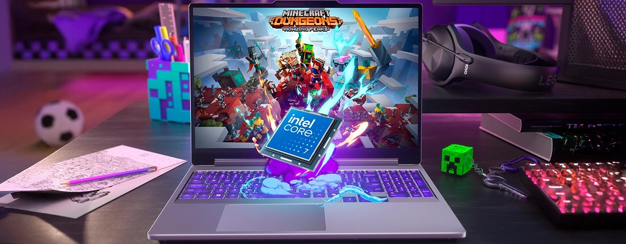 Lenovo LOQ Essential 15IRH11 laptop with Intel Core i7 emblem and Minecraft Dungeons on screen, surrounded by gaming gear.