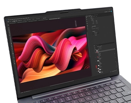 Cropped close-up of the Lenovo ThinkBook 14 Gen 9 laptop display, showcasing vibrant color swirls in a creativity app.