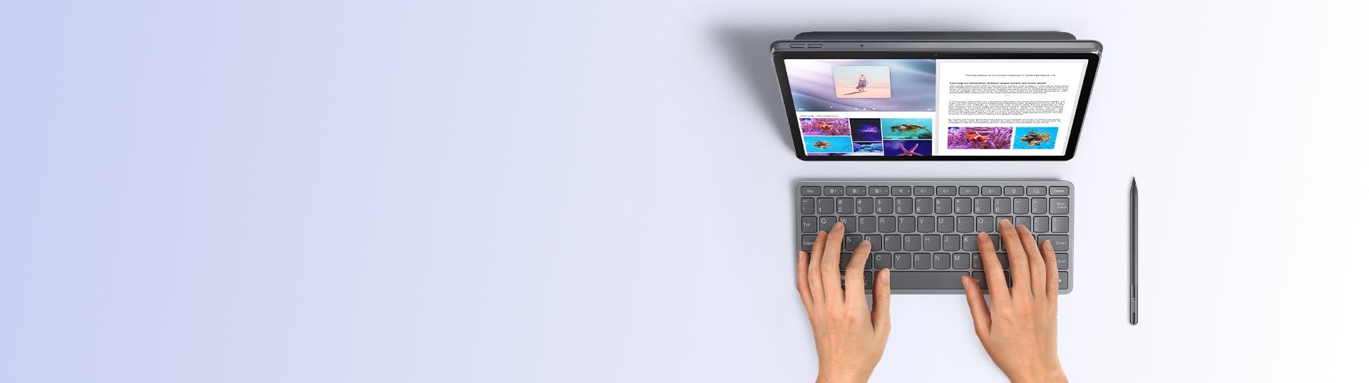 Bluetooth キーボードとスタイラスをデバイスの横に置き、Lenovo のタブレットで入力するユーザーの上面図。