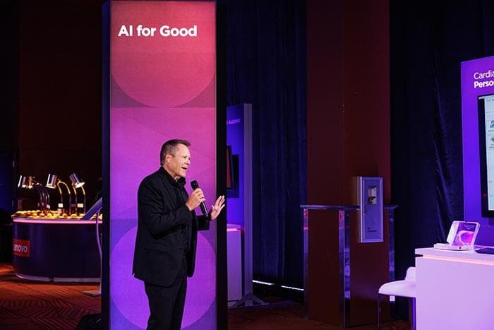 Doug Fisher at an event, with a backdrop that reads “AI for Good.'