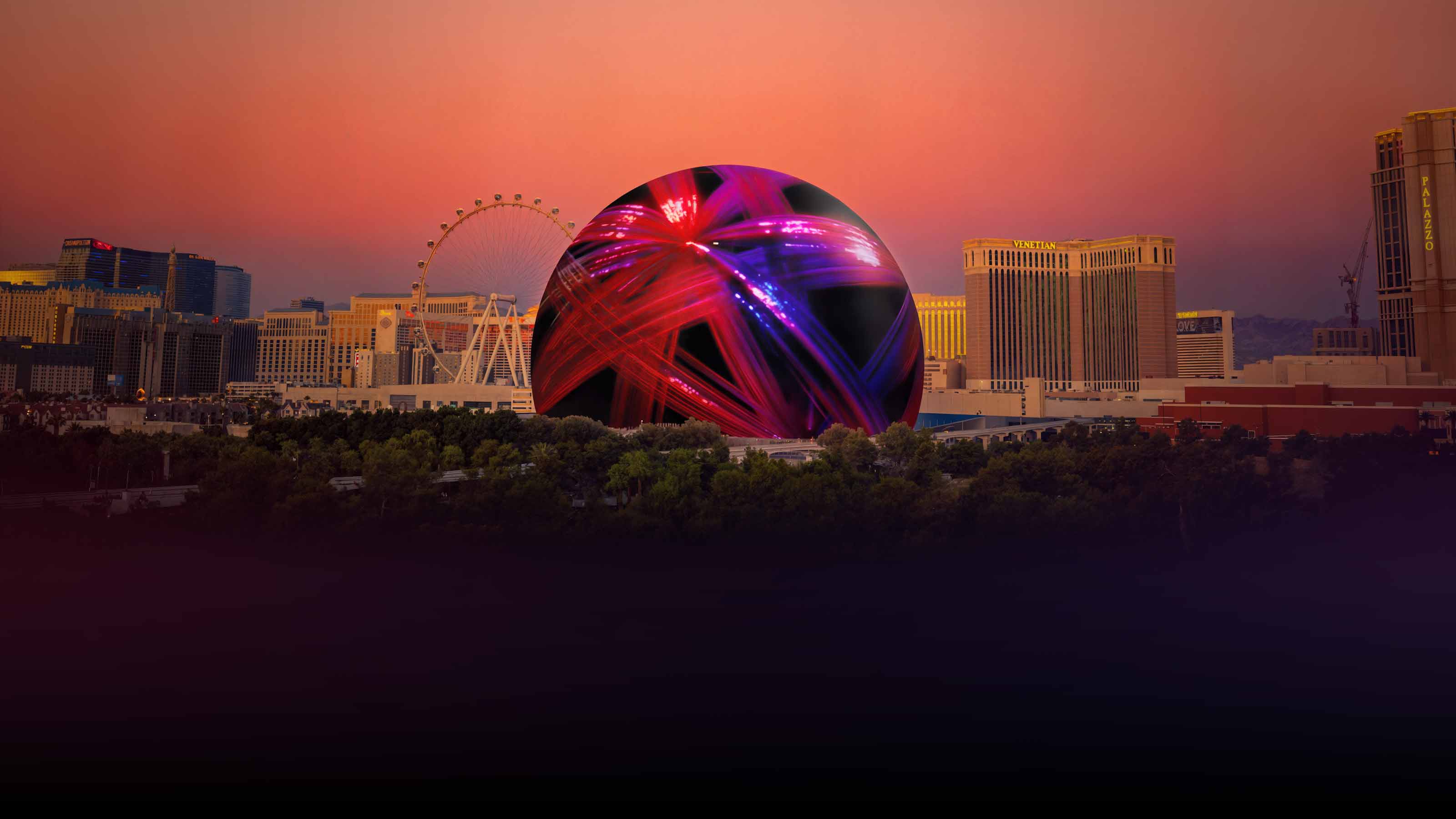 Las Vegas skyline at sunset featuring the illuminated Sphere with vibrant red and purple light patterns.