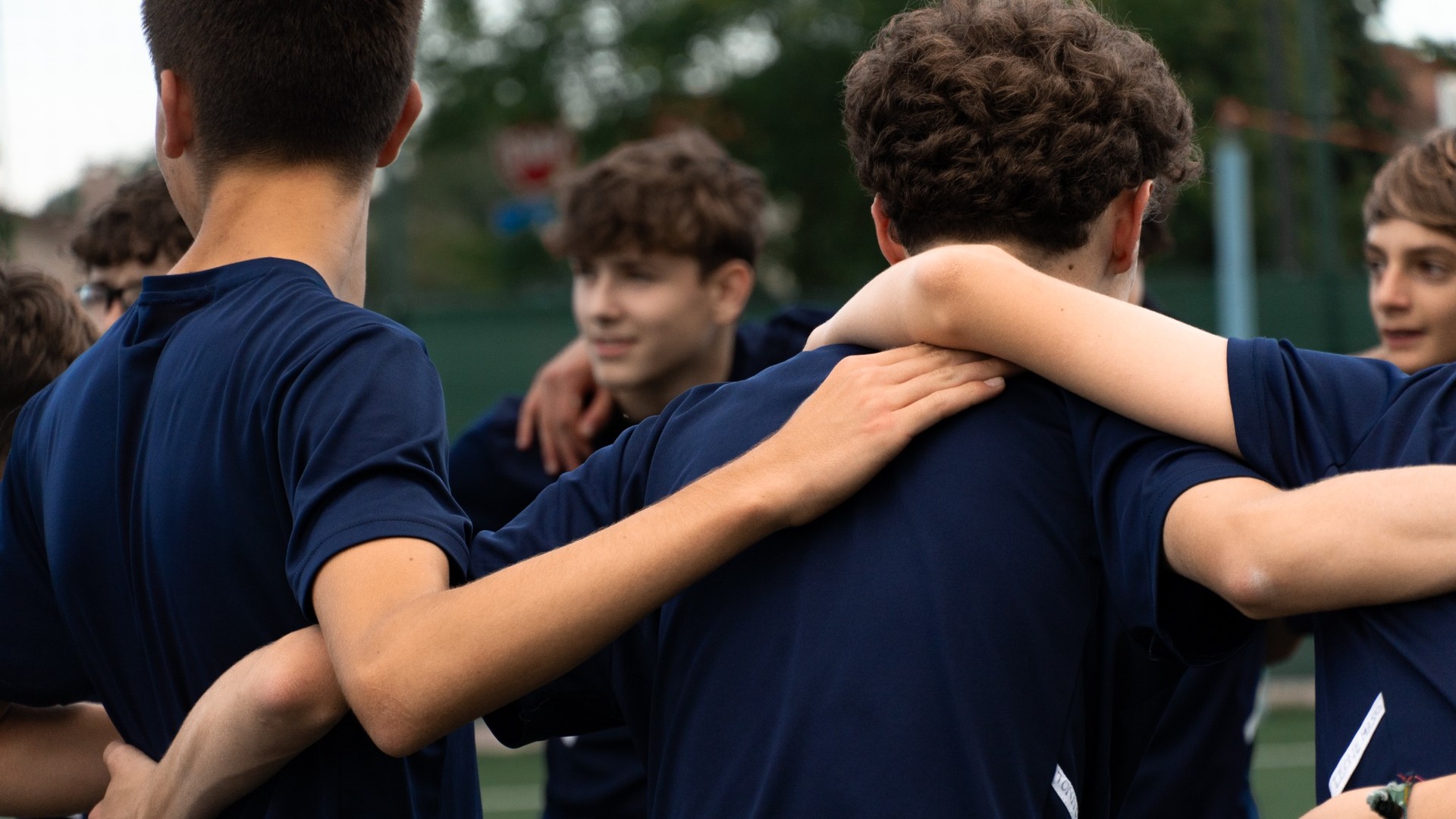 Young players gathered on the football pitch