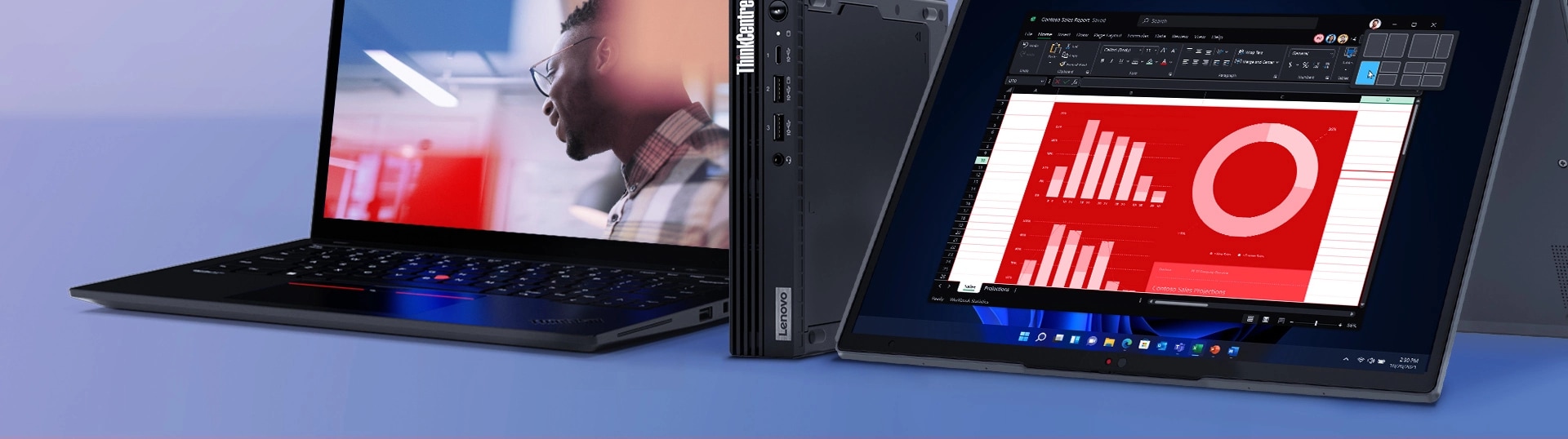 A ThinkPad T14 Gen 3 laptop a ThinkCentre Tiny Desktop and a ThinkPad Yoga Gen 7 laptop one next to the other  COMMENTS