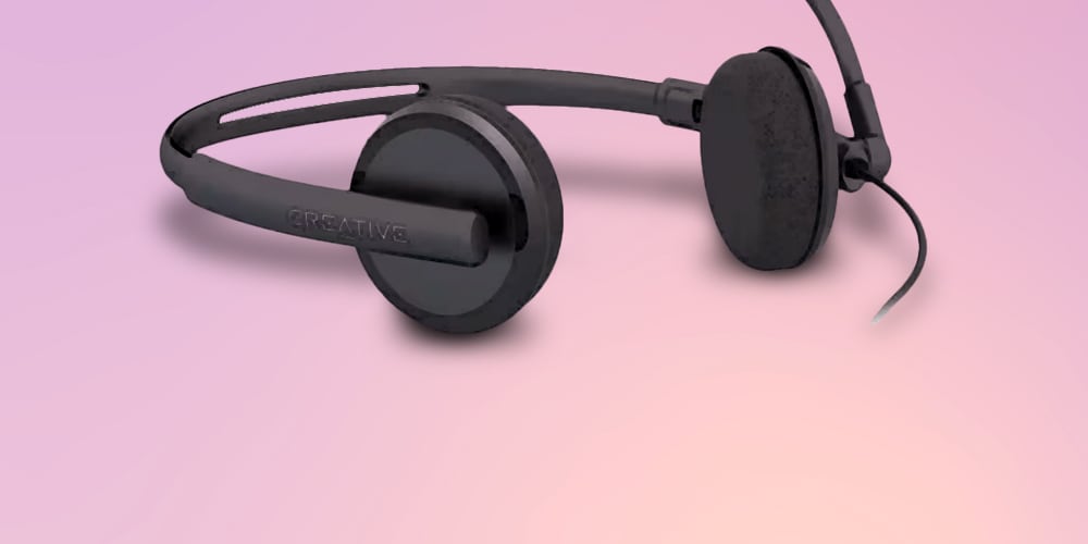 A Creative Labs HS-220 USB Headset with Noise-Cancelling and Inline Remote is featured on a background.