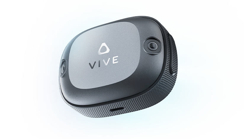 VIVE Ultimate Tracker, compact black VR tracking device with dual cameras and VIVE logo, shown in close-up.