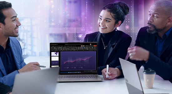 A person sits with a Lenovo ThinkBook laptop on their lap, dressed in a purple skirt and blue top, holding a red textured mug in one hand. The scene is well-lit with natural light, and the laptop lid is partially open, showcasing its sleek, silver-gray design and subtle branding.