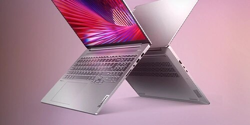 two ideapad laptops back to back on pink backgrpung