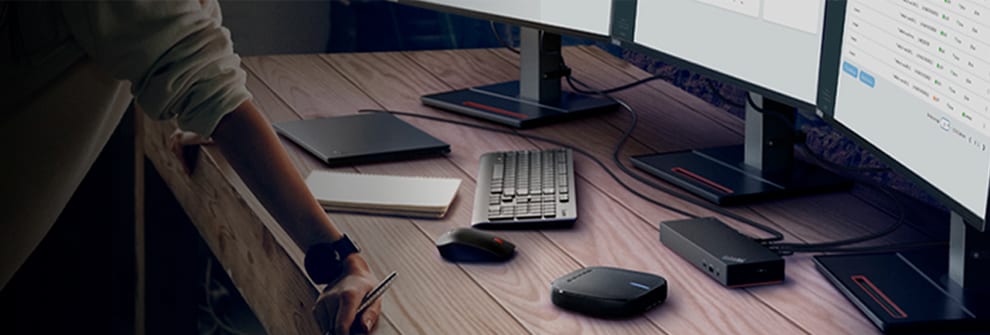A ThinkPad Docking Station is featured on a desk along with a ThinkPad Monitor and a Lenovo K&M.