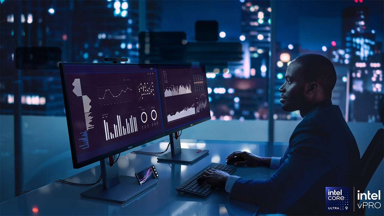 A man working in the office with a ThinkCentre M90a PC.