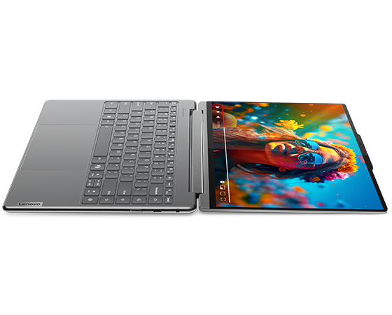 Yoga 9i 2-in-1 Gen 9 (14” Intel) in Luna Grey laying flat fully opened with screen on