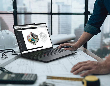 An architect working on 3D design software with Lenovo ThinkPad P16s i Gen 5 (Intel) mobile workstation amidst tools and blueprints.