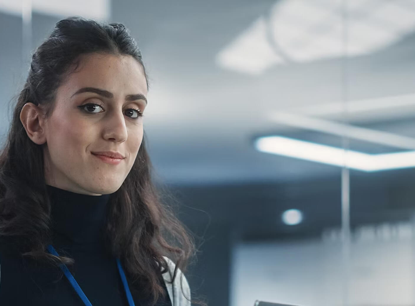 A woman wearing a lanyard.