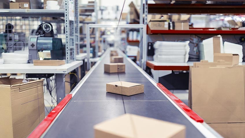 Boxes on a conveyor belt in a warehouse