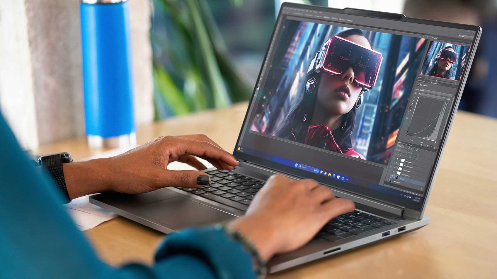 Hands typing on the keyboard of a laptop