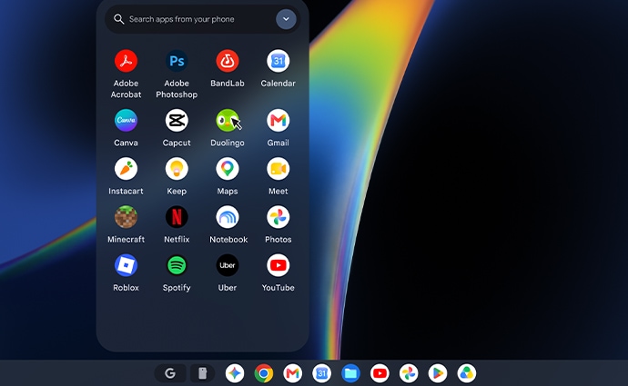 Apps display on an Android™ phone in front of the display of a Lenovo Googlebook 15 laptop.