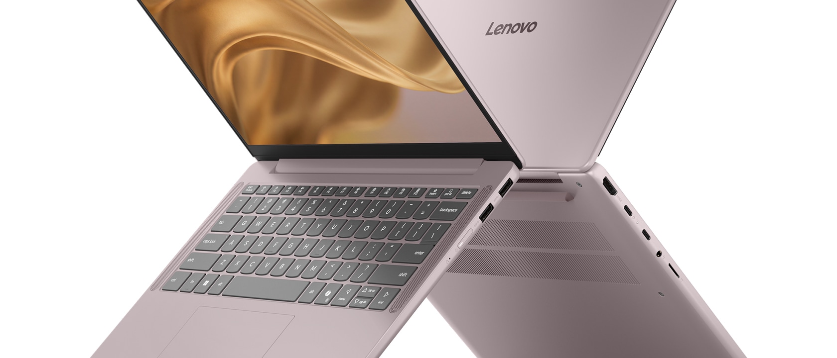 Dos laptops Lenovo IdeaPad Vibe de color violeta de ensueño, con las tapas abiertas, espalda con espalda en un patrón de 