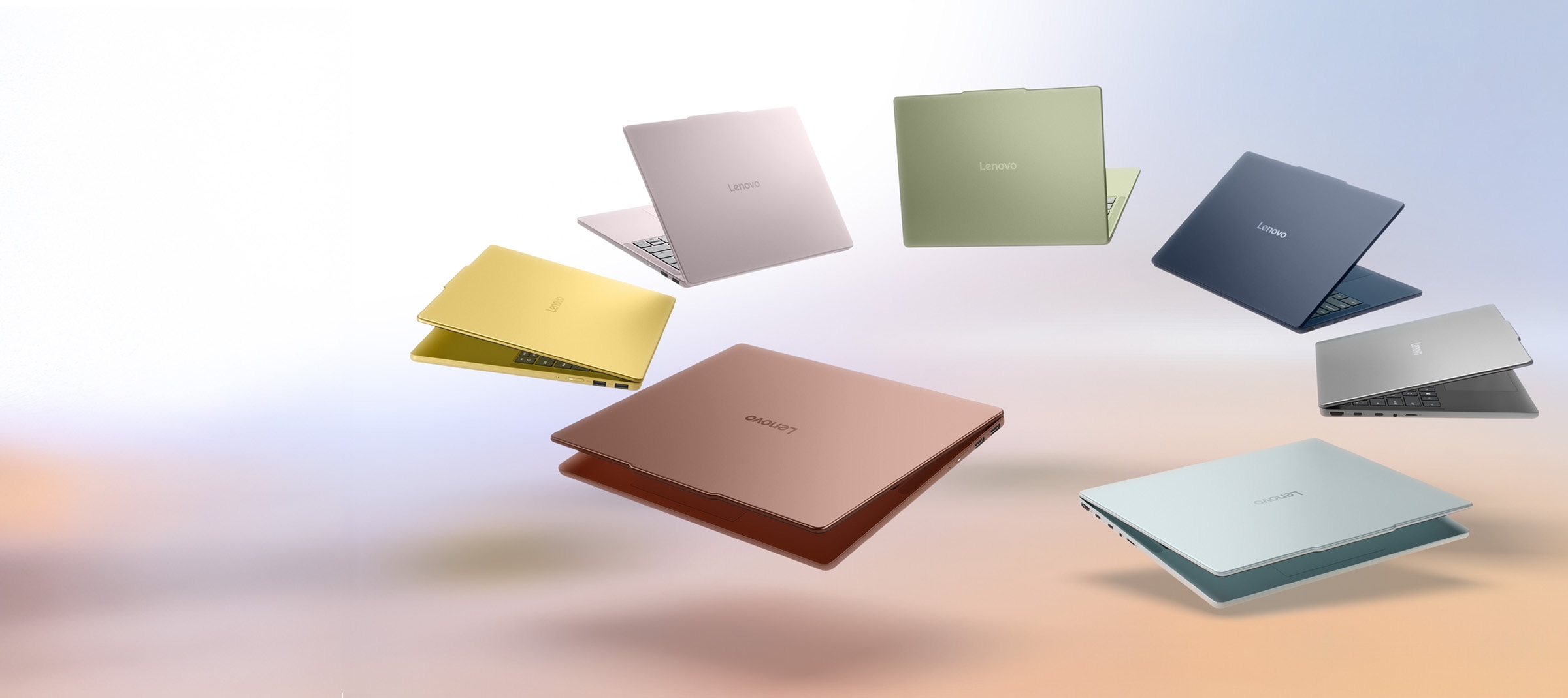 Seven slightly open Lenovo IdeaPad Vibe laptops arranged in a circle with their backs to one another, showing their array of colors: spicy gold, dreamy violet, zen green, moody blue, lowkey grey, chill blue, and radiant coral.