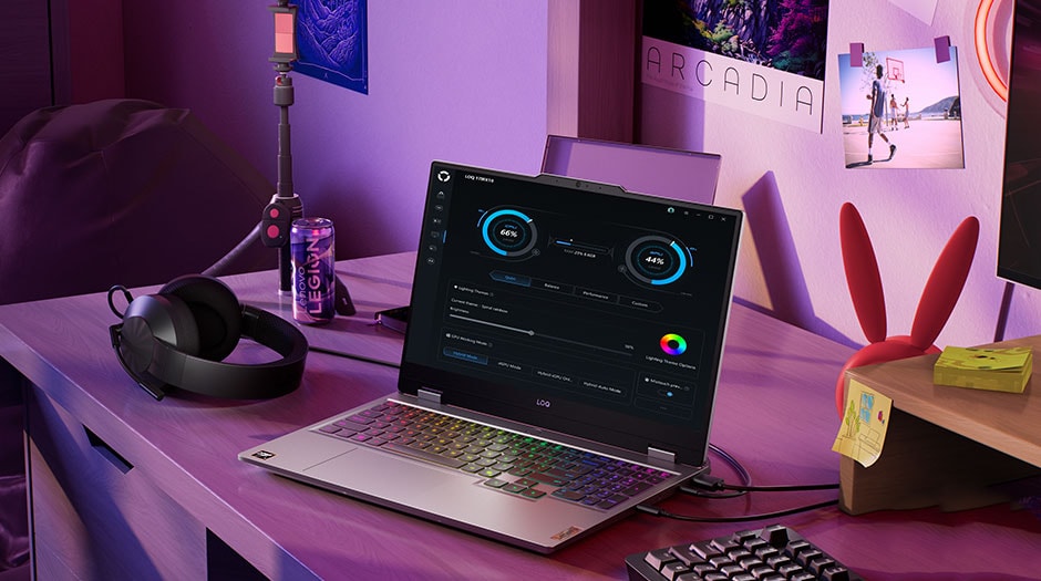 A Lenovo LOQ 15AHP10 on a desk with the Legion Space Device Management UI on the screen.