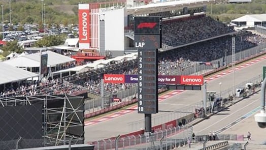 Panoramic shot of a Grand Prix race track focusing on the viewer's stands.