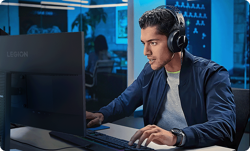 A lifestyle photo shows a man using the legion 24-10 monitor with less eyes strain. מסך מחשב גיימינג Legion 24-10 מבית Lenovo