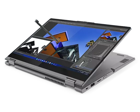 A 2-in-1 ThinkBook 14s Yoga Gen 2 laptop—mineral grey version—with the display flipped around into tablet mode and the included stylus pen floating as if in use.