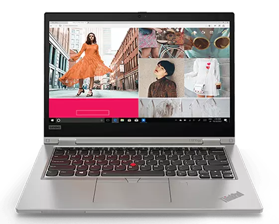 Front view of a silver ThinkPad L13 Yoga Gen 2 (13'' AMD), showing touchpad, keyboard, and display with a fashion show image on the screen