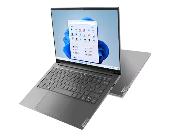 Linkerzijkant van twee Yoga Slim 7 Pro Gen 7 (14″ AMD) laptops naast elkaar, één geopend, met toetsenbord en scherm met Windows 11, de ander gesloten