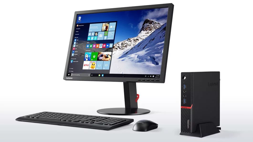Lenovo ThinkCentre M700 Tiny, front right side view with monitor, keyboard, and mouse