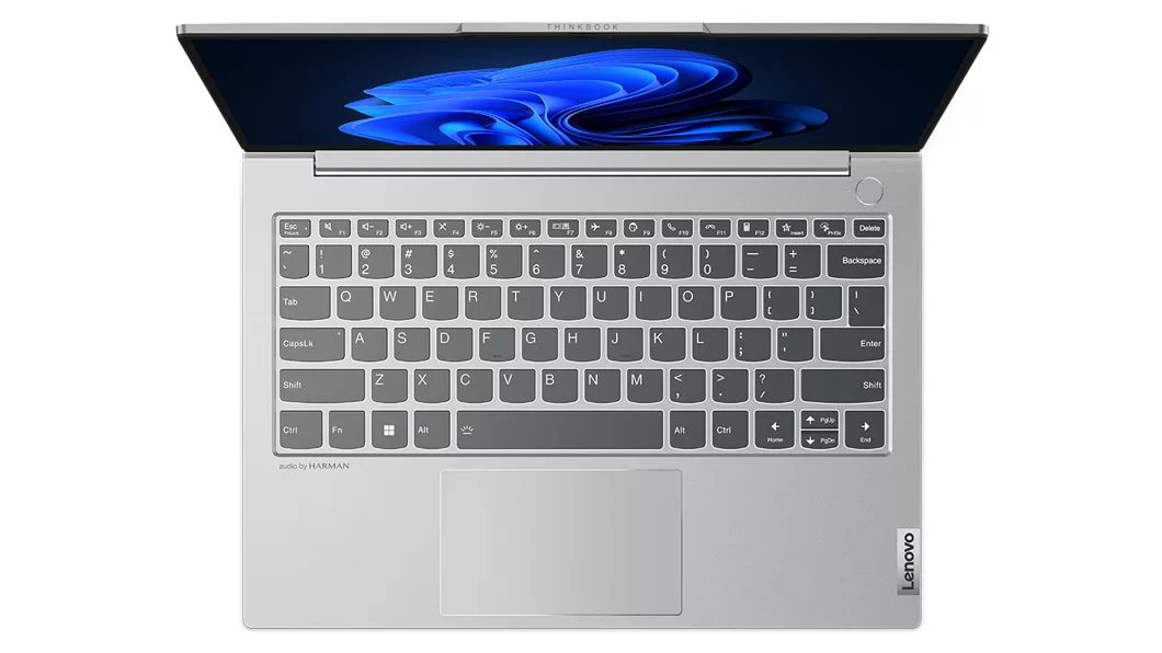 Overhead shot of Lenovo ThinkBook 13s Gen 4 laptop in Cloud Grey, with focus on keyboard.
