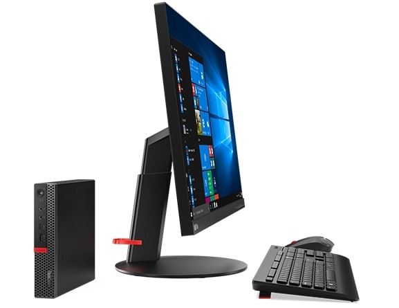 Front view of Lenovo ThinkCentre M920 Tiny set next to side facing desktop, keyboard and mouse