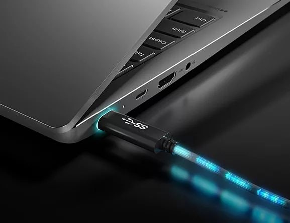 Three-quarter back view crop of Lenovo IdeaPad 5i Gen 7 laptop PC, showing Charge Boost charging via USB port.