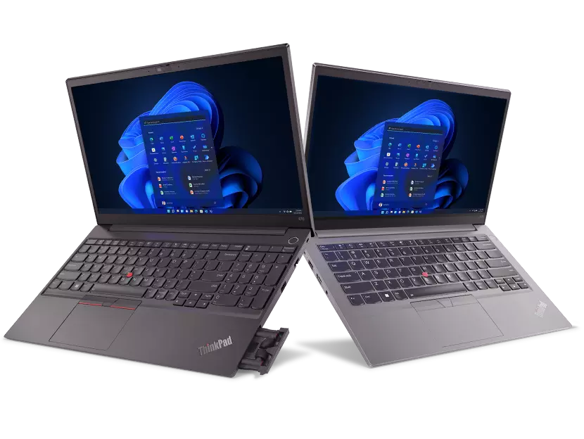 Two Lenovo ThinkPad E series laptops, side by side, opened 90 degrees, both showing display with Windows 11  & keyboard.