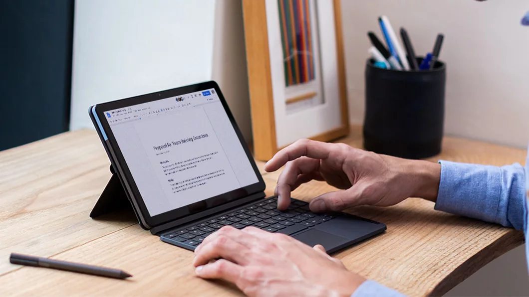 The IdeaPad Duet Chromebook with a proposal being written in Google Docs