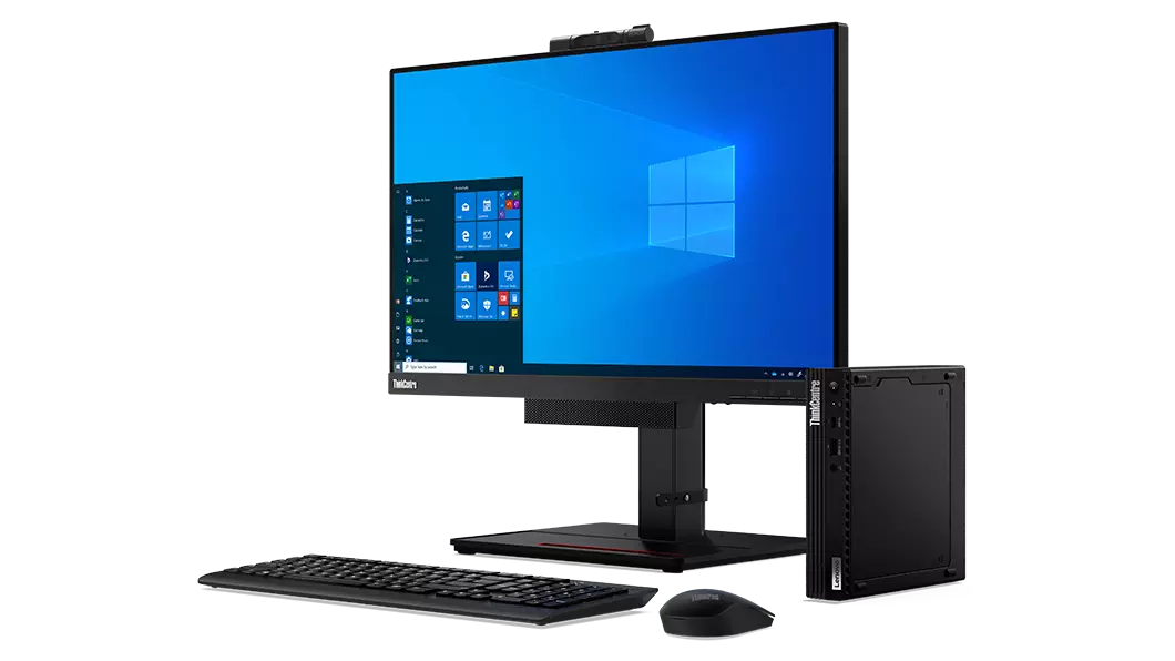 El Lenovo ThinkCentre M75q de 2.ª generación colocado al lado de un monitor, un teclado y un ratón